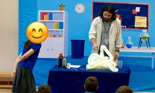 Atomic Tom making Elephants' Toothpaste with a female student